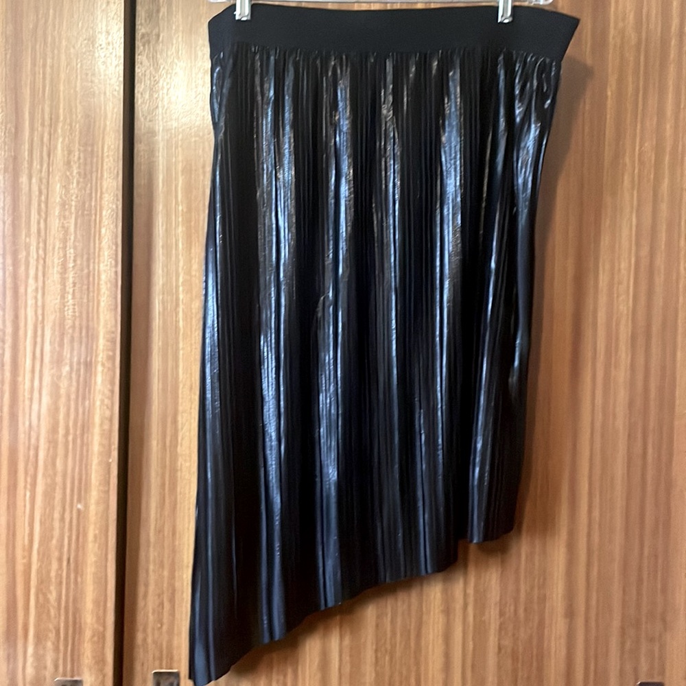 Never worn black Love and Legend black pleated skirt with asymmetrical hem.
